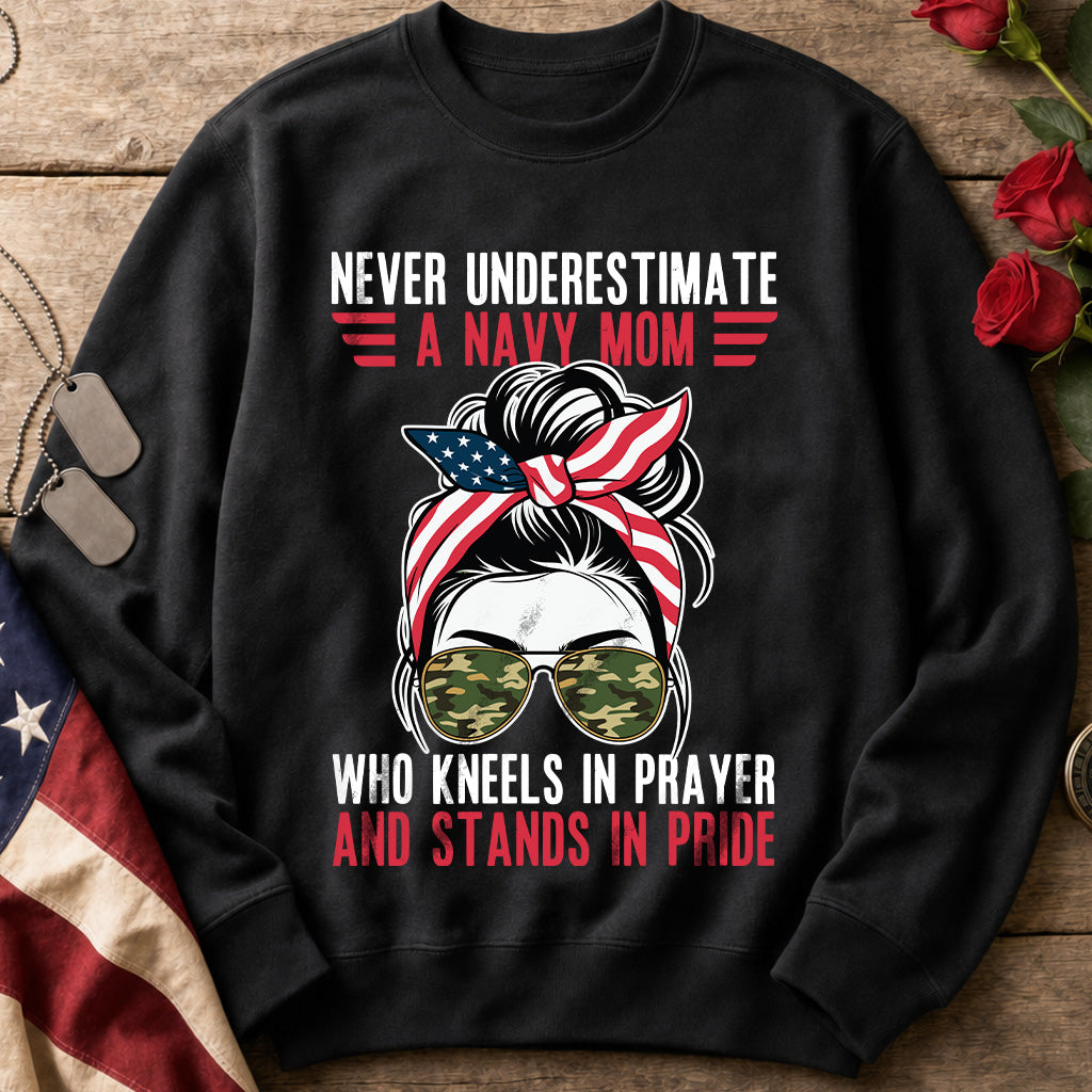 Never Underestimate a Navy Mom navy sweatshirt with messy bun, patriotic bandana and camo sunglasses design